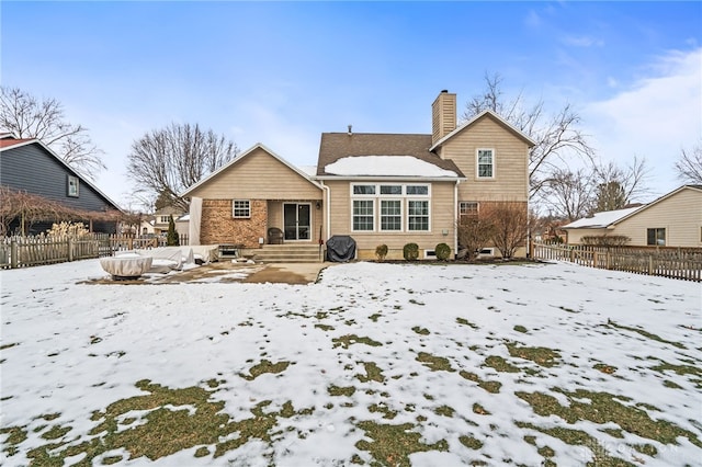 view of snow covered house