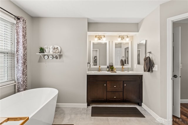 bathroom with vanity and a tub