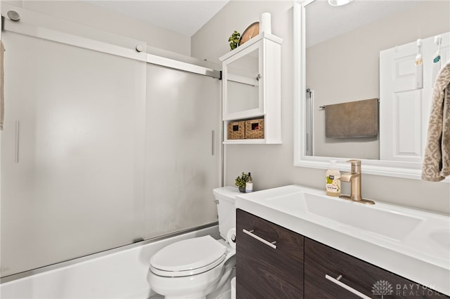 full bathroom featuring vanity, shower / bath combination with glass door, and toilet