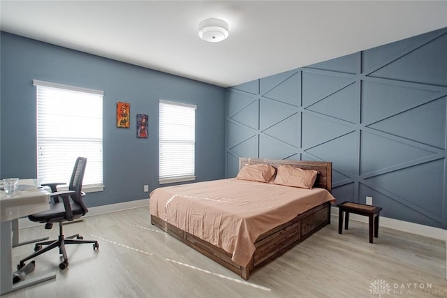 bedroom with hardwood / wood-style floors