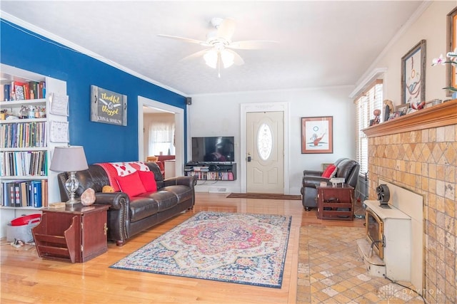 111 W Pinehurst St, Sidney, OH 45365 - living room featuring crown molding, a ceiling fan, wood finished floors, and a healthy amount of sunlight