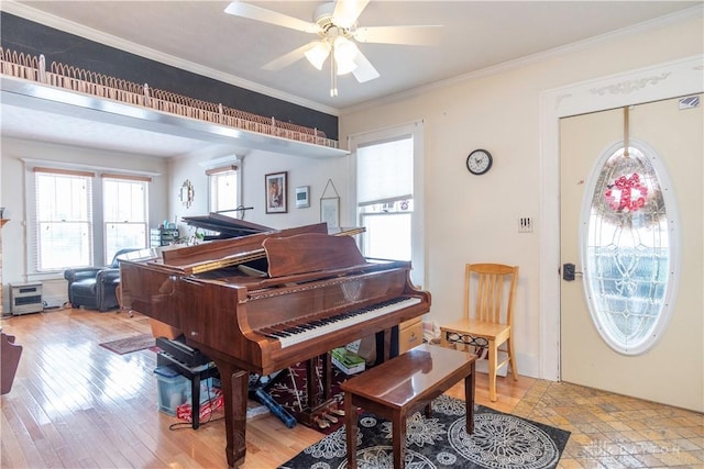 111 W Pinehurst St, Sidney, OH 45365 - sitting room with ornamental molding, ceiling fan, light wood-style flooring, and plenty of natural light