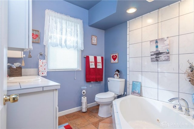 111 W Pinehurst St, Sidney, OH 45365 - bathroom featuring toilet, a jetted tub, vanity, and baseboards
