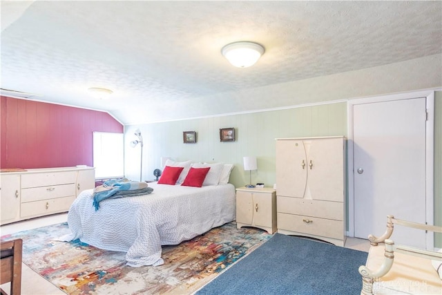 111 W Pinehurst St, Sidney, OH 45365 - bedroom featuring a textured ceiling, wood walls, and lofted ceiling