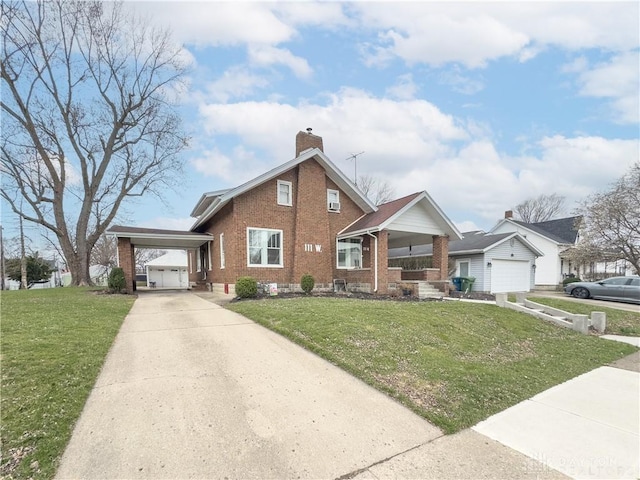 111 W Pinehurst St, Sidney, OH 45365 - view of front facade with a chimney, a porch, brick siding, driveway, and a front lawn