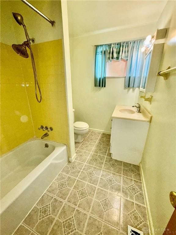 full bathroom featuring vanity, toilet, and tiled shower / bath