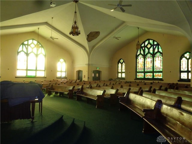 recreation room featuring high vaulted ceiling, ceiling fan, and carpet