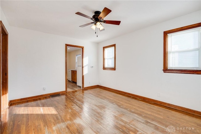 spare room with ceiling fan and light hardwood / wood-style flooring