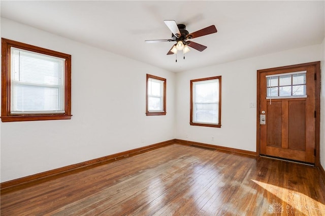 foyer entrance with hardwood / wood-style flooring and ceiling fan