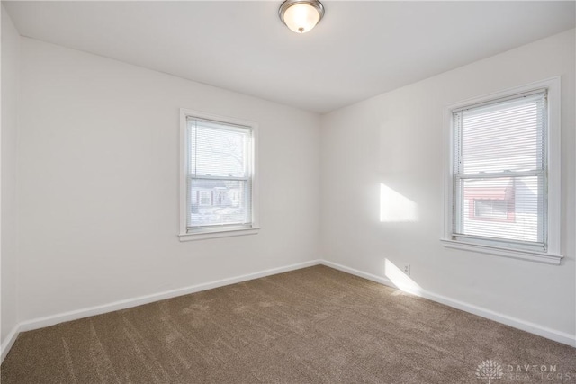 unfurnished room with carpet flooring