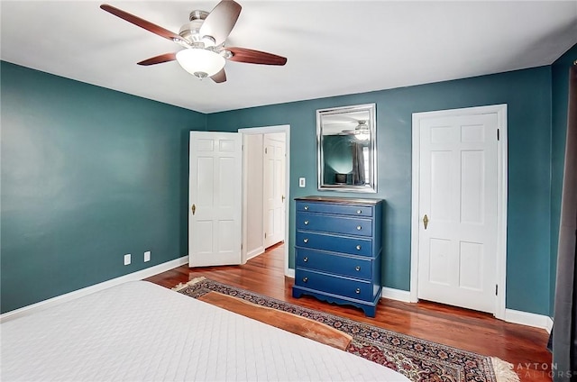 bedroom featuring ceiling fan and dark hardwood / wood-style flooring