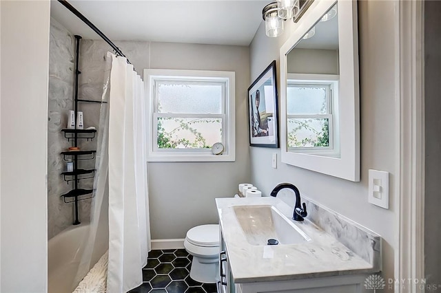 full bathroom with vanity, toilet, and shower / bath combo