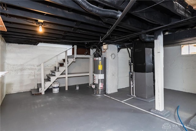 basement featuring heating unit and gas water heater