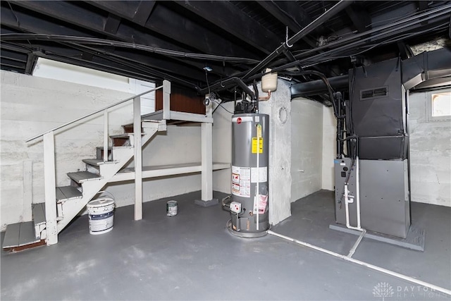 basement with gas water heater and heating unit