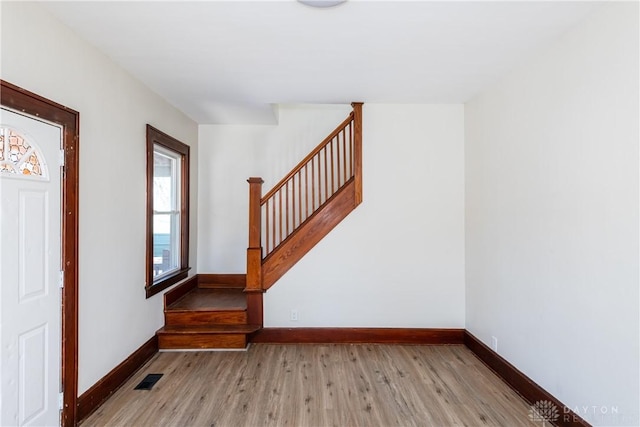 entryway with light hardwood / wood-style flooring