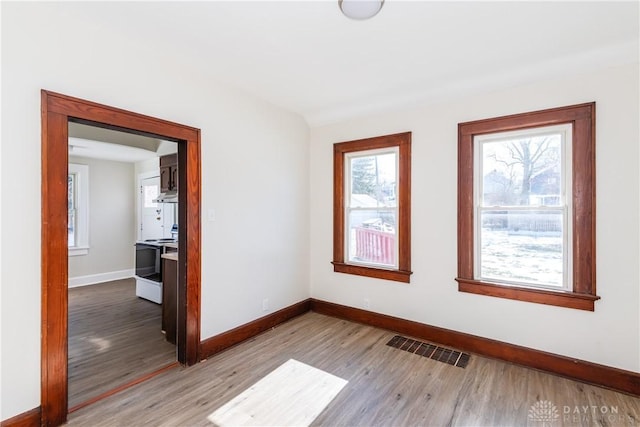 unfurnished room featuring light hardwood / wood-style flooring