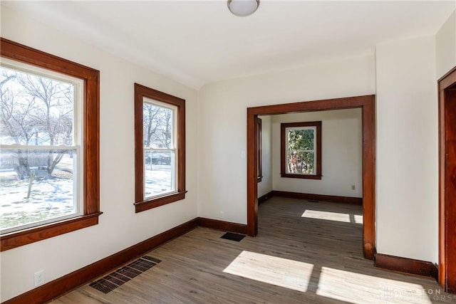 hallway with dark hardwood / wood-style floors