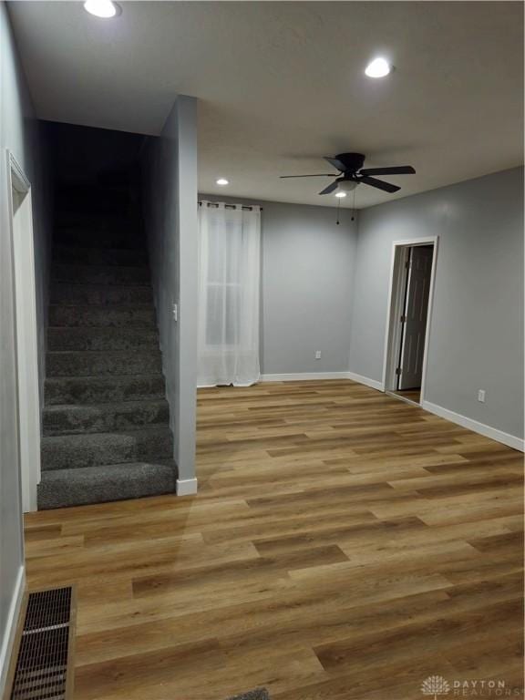 interior space with ceiling fan and light hardwood / wood-style floors