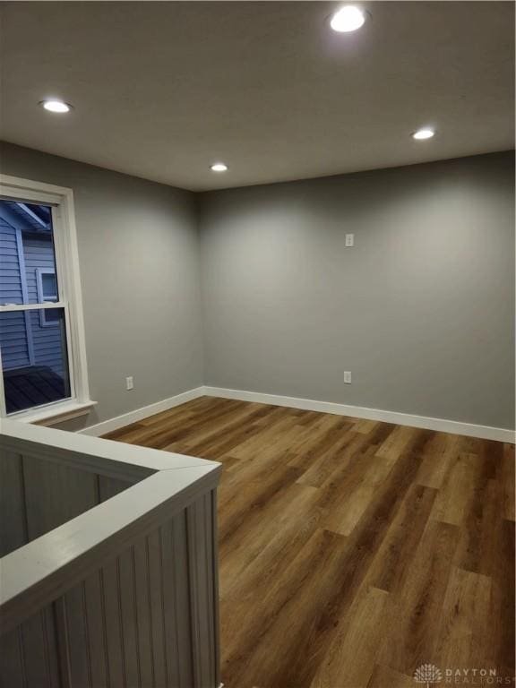 empty room with dark wood-type flooring