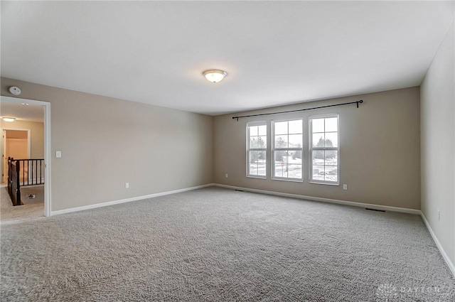 empty room featuring light carpet