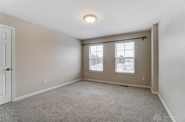 unfurnished room featuring carpet floors