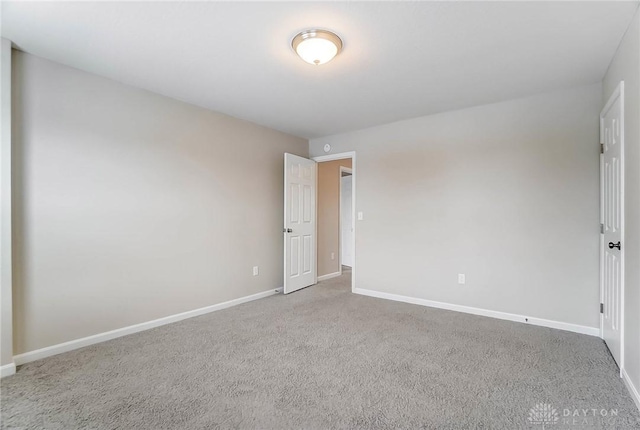 unfurnished room featuring carpet flooring