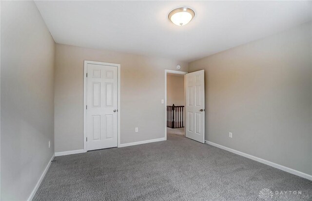 unfurnished bedroom with carpet floors