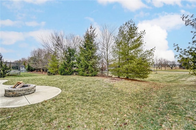 view of yard with an outdoor fire pit