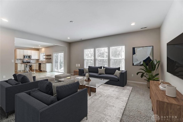 living room with light colored carpet