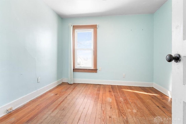 spare room with light hardwood / wood-style floors