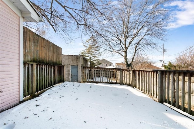 view of yard layered in snow