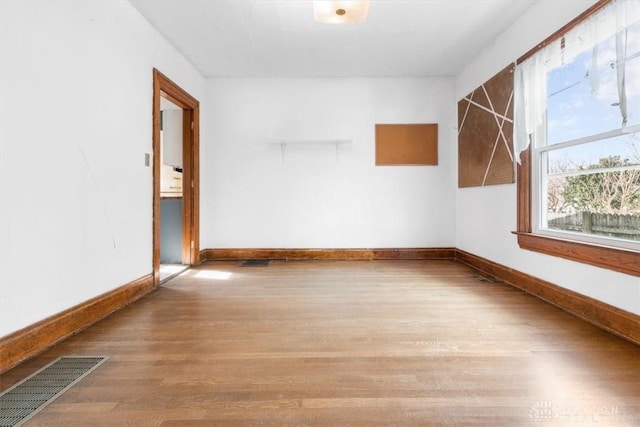 unfurnished room featuring light hardwood / wood-style floors