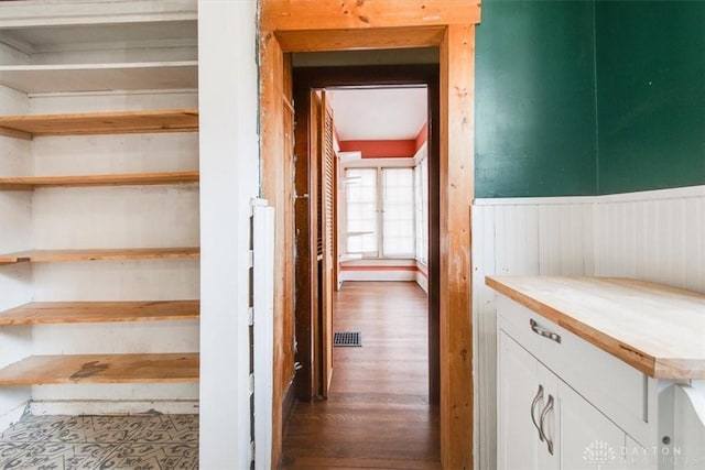 stairway with hardwood / wood-style floors