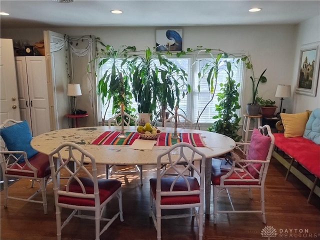 dining room with dark wood-type flooring