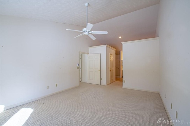 empty room with high vaulted ceiling, a textured ceiling, light colored carpet, and ceiling fan