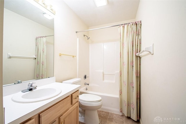 full bathroom with vanity, shower / tub combo, tile patterned floors, and toilet