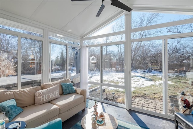 sunroom / solarium with lofted ceiling, a healthy amount of sunlight, and ceiling fan