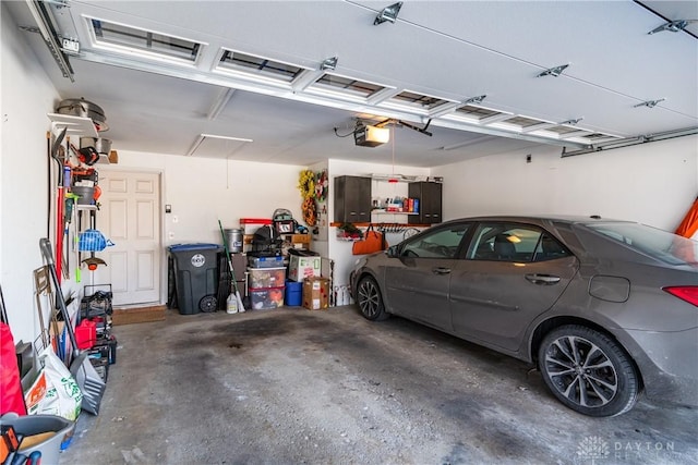 garage featuring a garage door opener