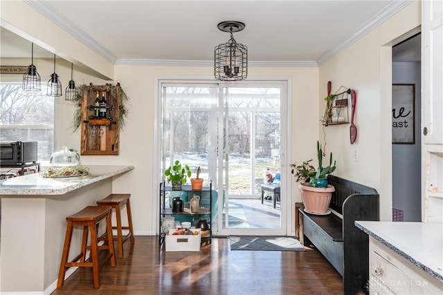 entryway featuring ornamental molding and dark hardwood / wood-style flooring