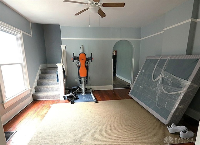 2318 Home Ave Unit 2316, Dayton, OH 45417 - workout room featuring wood finished floors, arched walkways, and ceiling fan