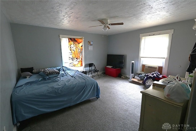 2318 Home Ave Unit 2316, Dayton, OH 45417 - bedroom with carpet floors, cooling unit, a ceiling fan, and a textured ceiling