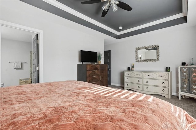 bedroom featuring ceiling fan, carpet flooring, and a raised ceiling