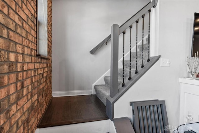 stairway with brick wall