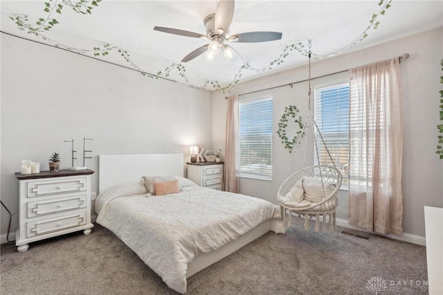 carpeted bedroom with ceiling fan