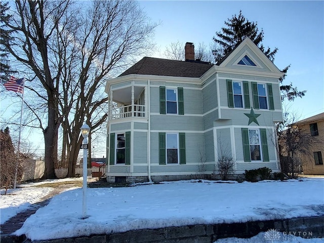 view of front of house with a balcony