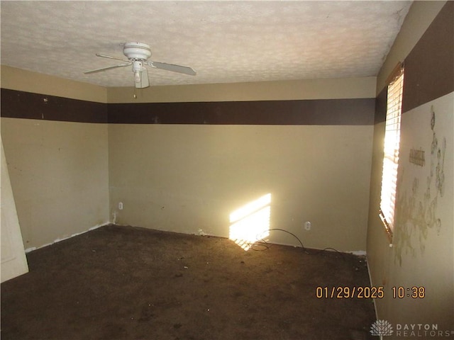 unfurnished room featuring a textured ceiling and ceiling fan