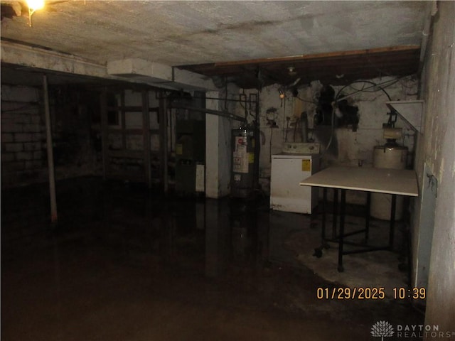 basement featuring washer / dryer and water heater