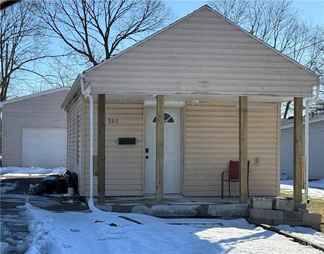 exterior space featuring an outbuilding and a garage