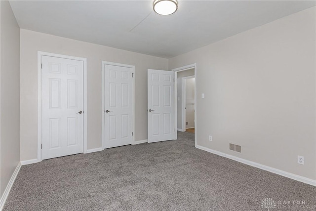 unfurnished bedroom with carpet