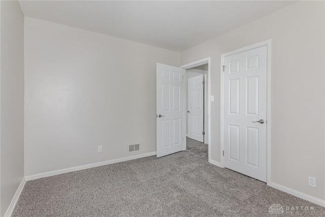 empty room with light colored carpet